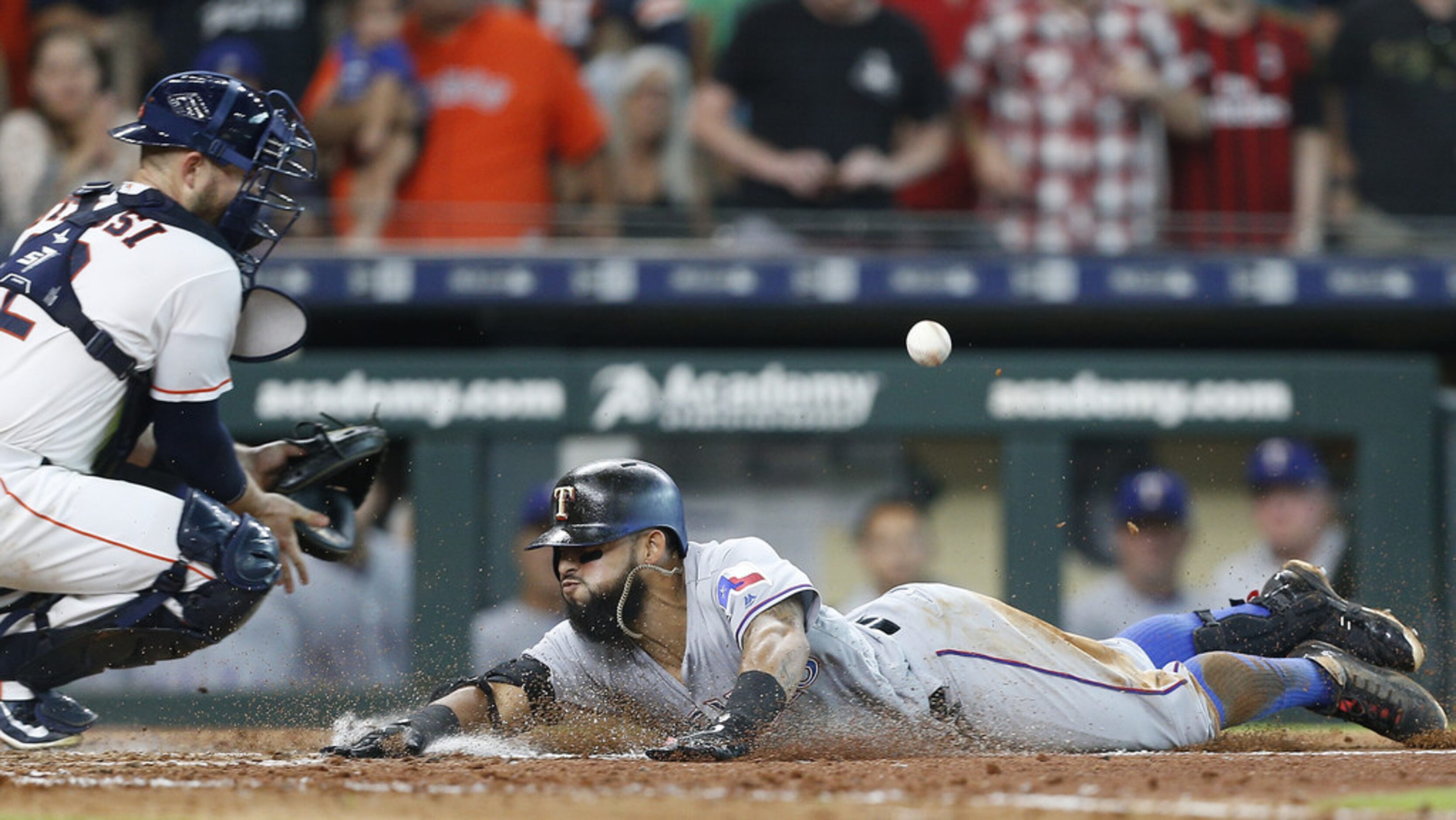 HOUSTON, TX - JULY 28:  Rougned Odor #12 of the Texas Rangers slides safely into home plate...