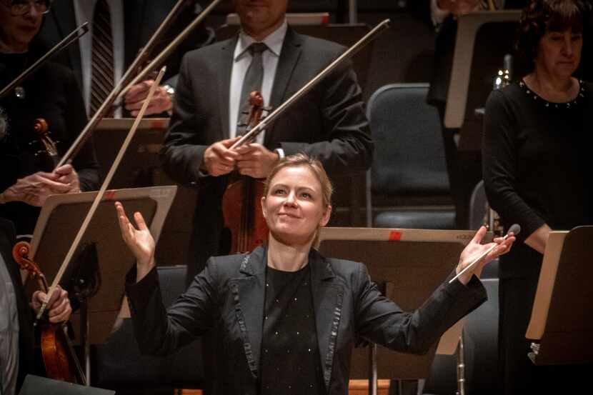Gemma New, the Dallas Symphony Orchestra’s new principal guest conductor greets the audience...