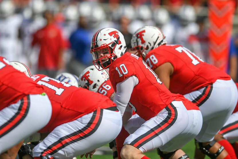 LUBBOCK, TX - OCTOBER 20: Alan Bowman #10 of the Texas Tech Red Raiders calls signals at the...