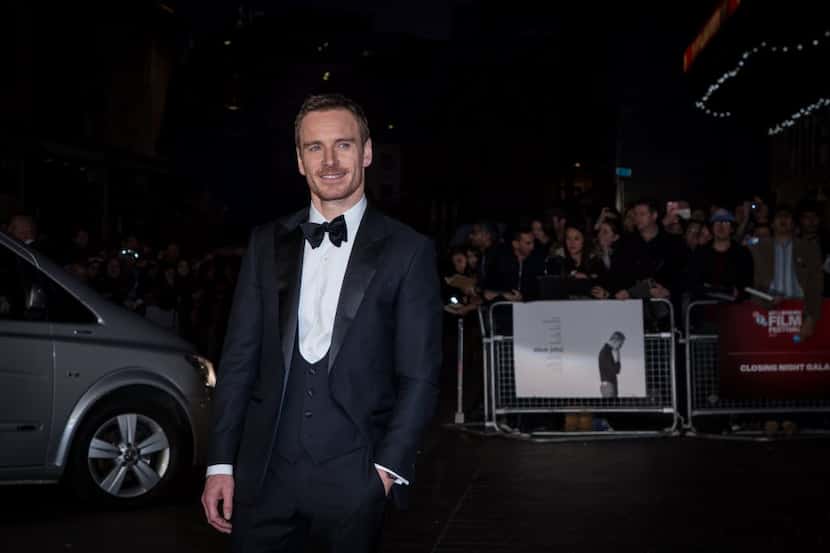 Michael Fassbender poses for photographers upon arrival at the premiere of the film 'Steve...