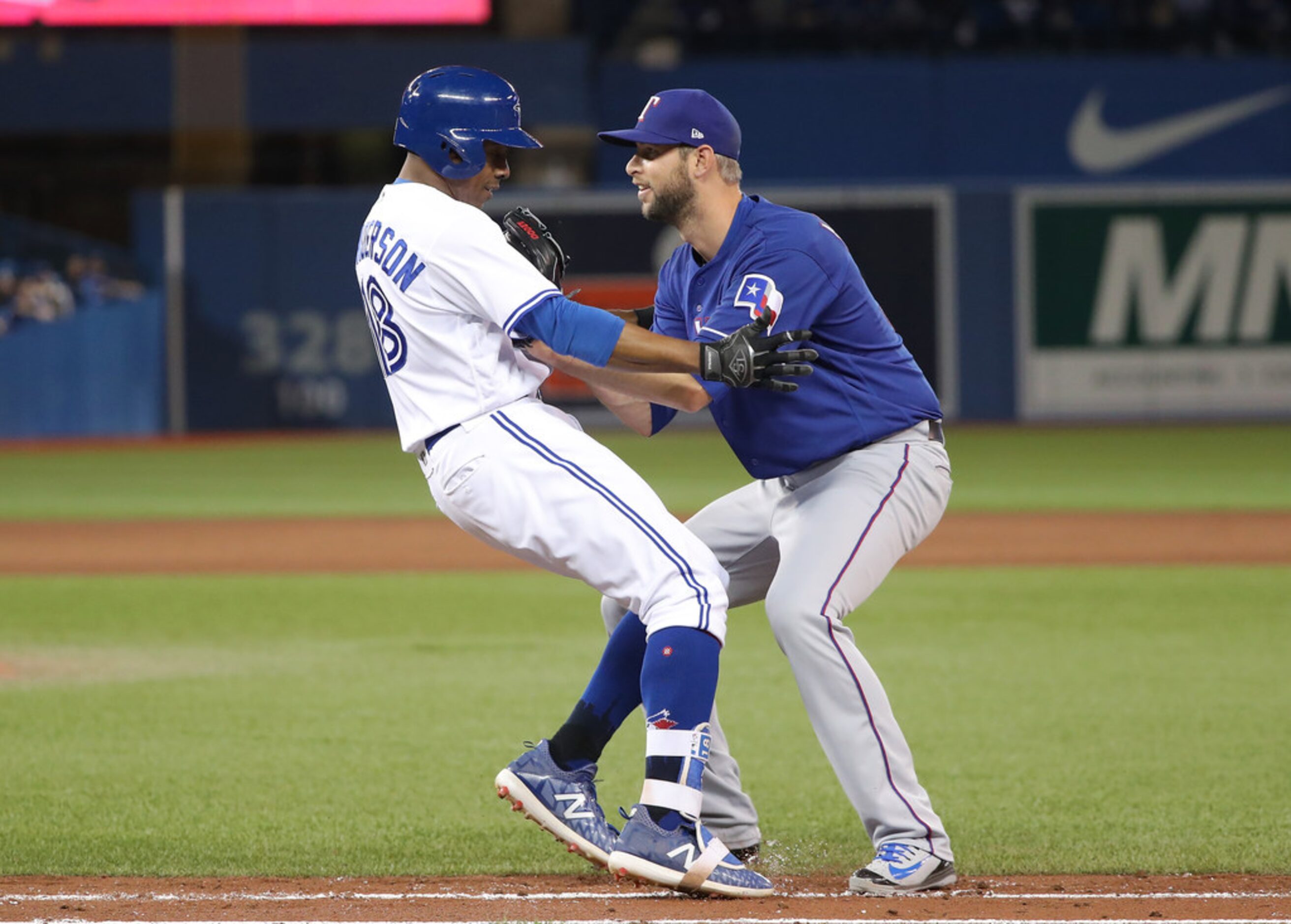 TORONTO, ON - APRIL 27: Curtis Granderson #18 of the Toronto Blue Jays is tagged out by...