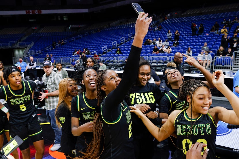 DeSoto guard Ayanna Thompson (20) takes a selfie after winning the Class 6A state...