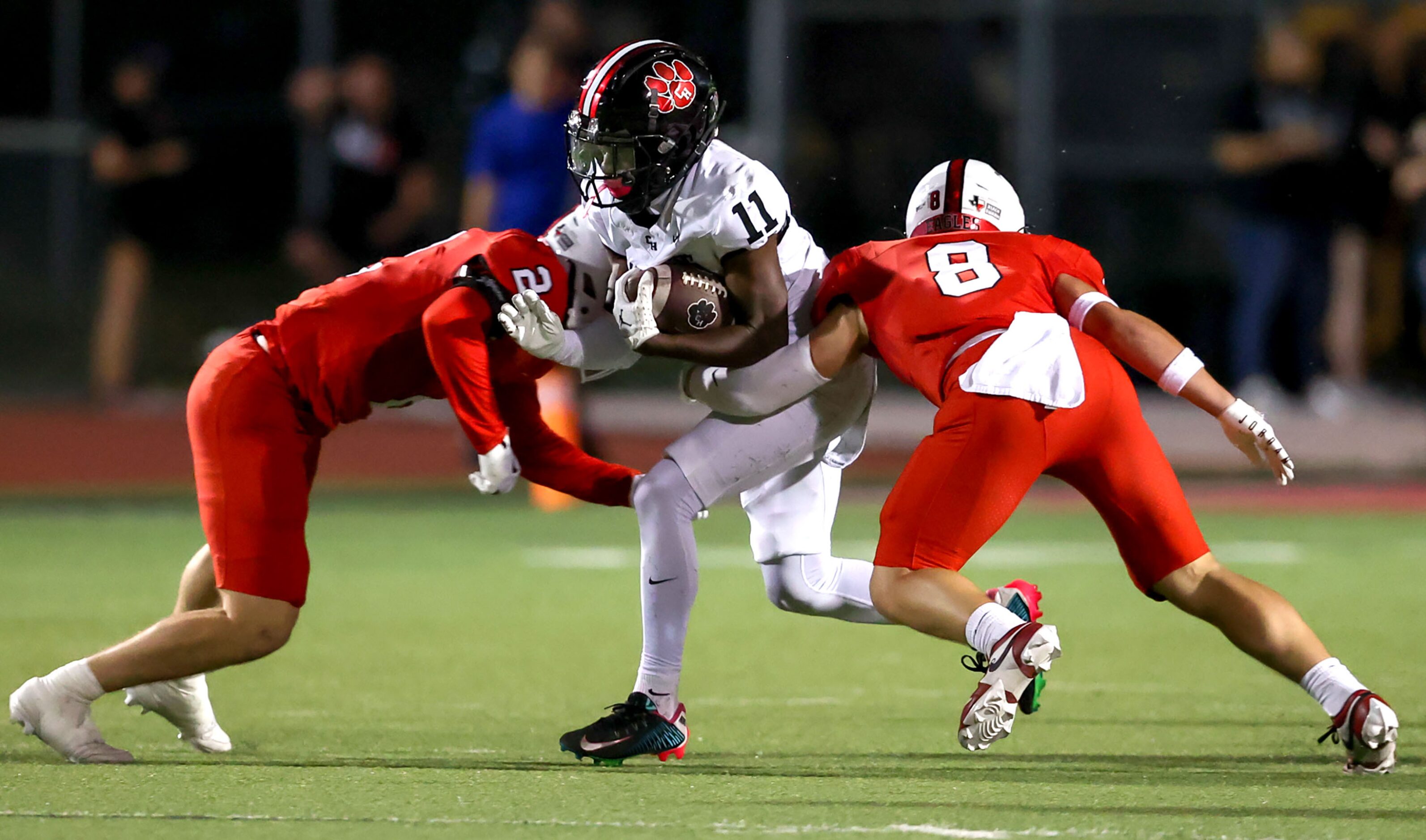 Colleyville Heritage running back Jerrod Wiley (11) tries to run between Argyle defensive...