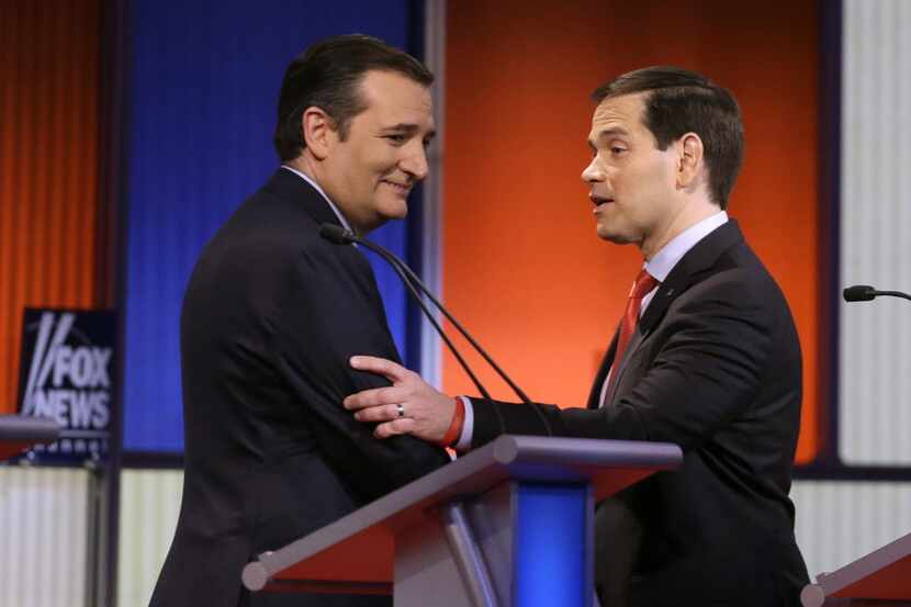 Sens. Ted Cruz and Marco Rubio chatted after a Republican presidential primary debate Jan....