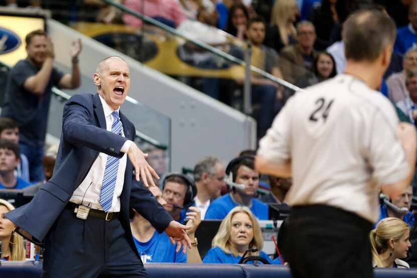 Dallas Mavericks head coach Rick Carlisle argues the lack of a foul called with referee Mike...