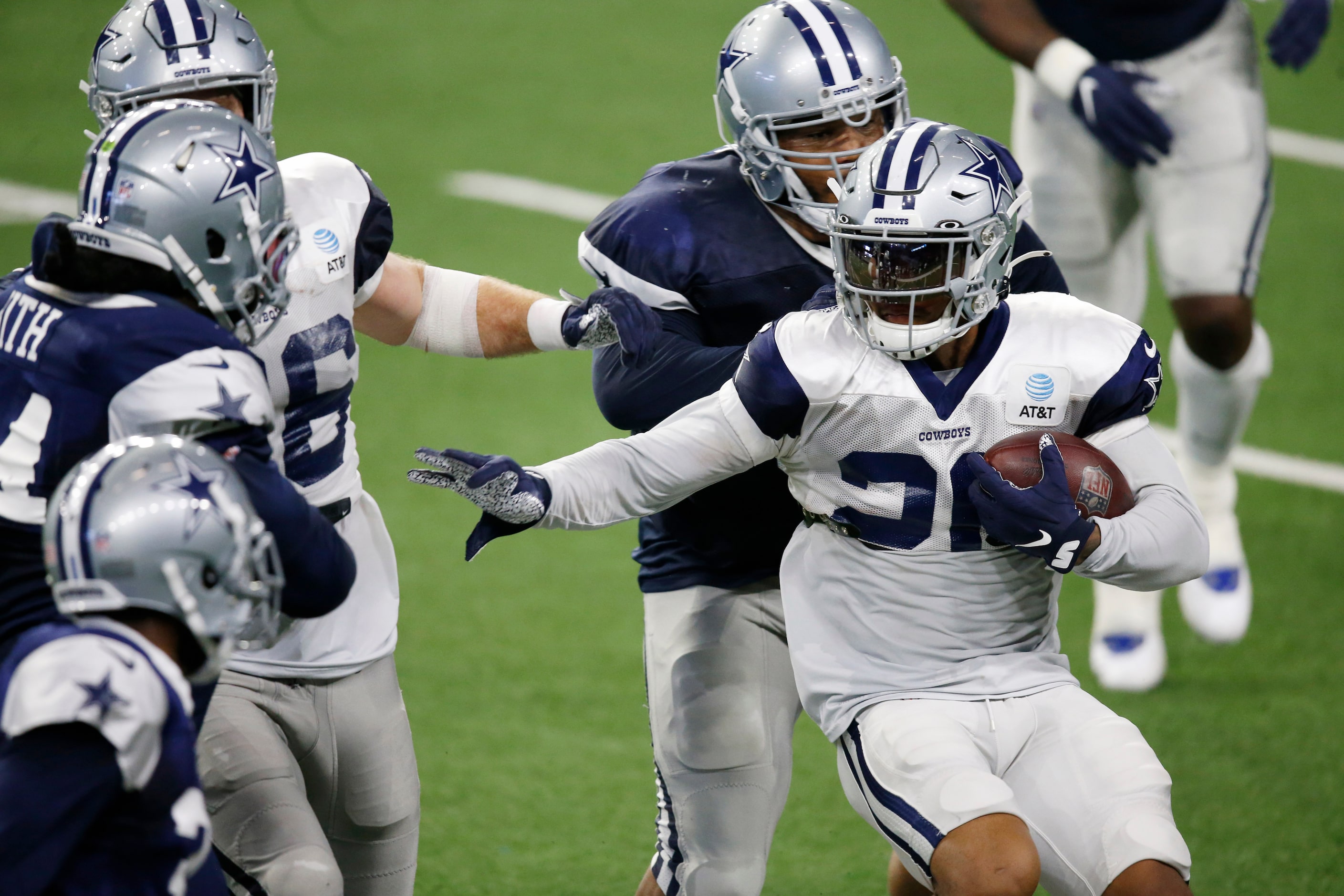 Dallas Cowboys running back Tony Pollard (20) looks to run up the field as Dallas Cowboys...