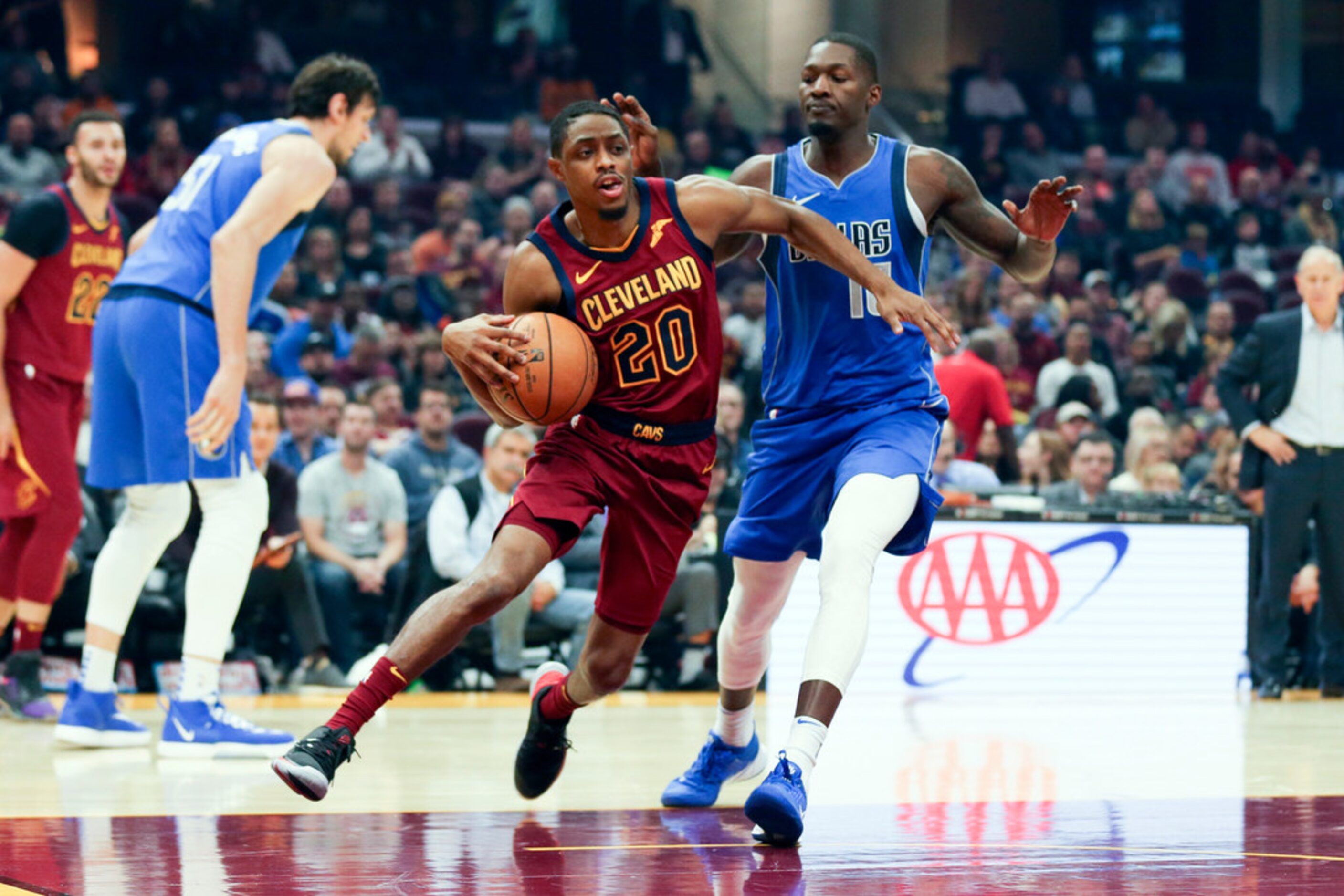 Cleveland Cavaliers' Brandon Knight (20) drives around Dallas Mavericks' Dorian Finney-Smith...