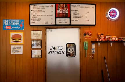 Nostalgic collectibles are hung on the wall behind Herby's Burgers in Oak Cliff.