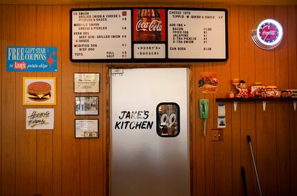 Nostalgic collectibles are hung on the wall behind Herby's Burgers in Oak Cliff.