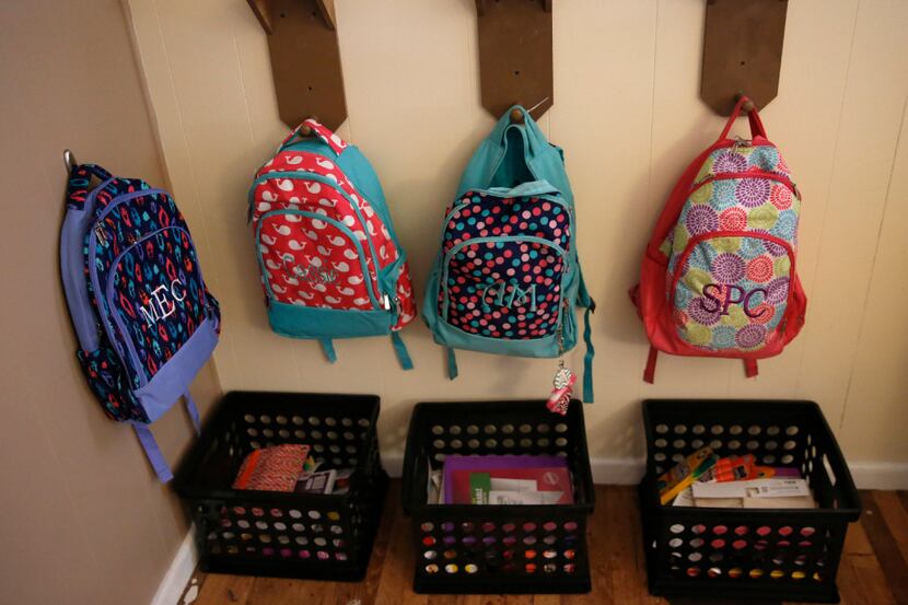 Backpacks and schoolwork were organized for Angela Cook's children and foster children at...