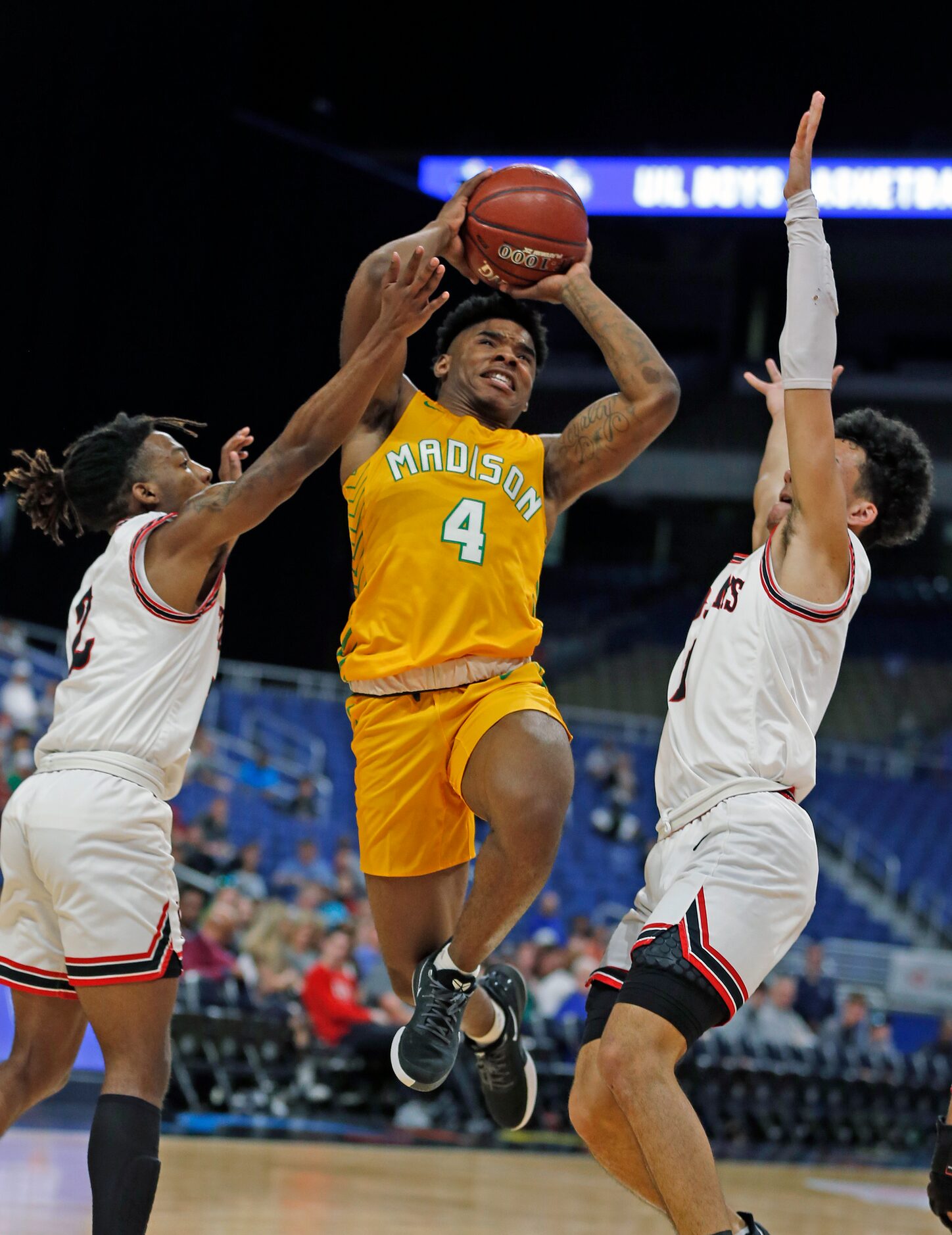 Madison guard Tavorice Weaver #4 drives for two. Madison defeated Coldspring-Oakhurst 90-73....