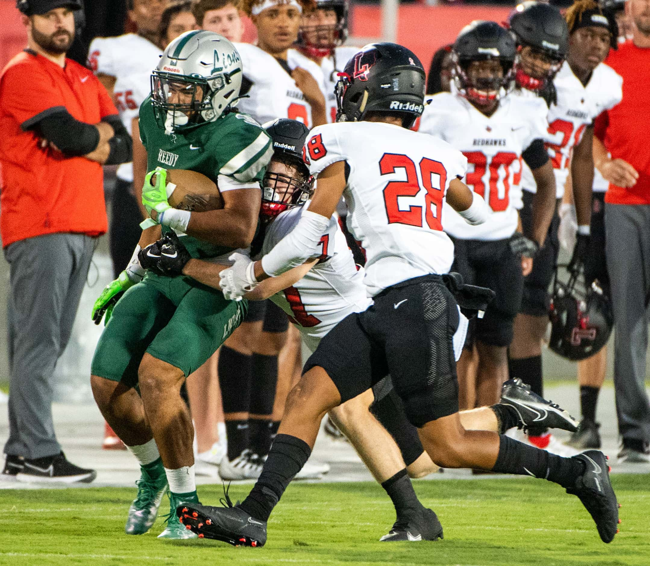 Frisco Reedy's Dennis Moody (3) runs through a tackle attempt by Frisco Liberty's Dillon...