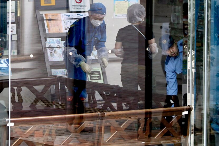 Police investigators check the Tsukui Yamayuri-en, a facility for the mentally disabled...