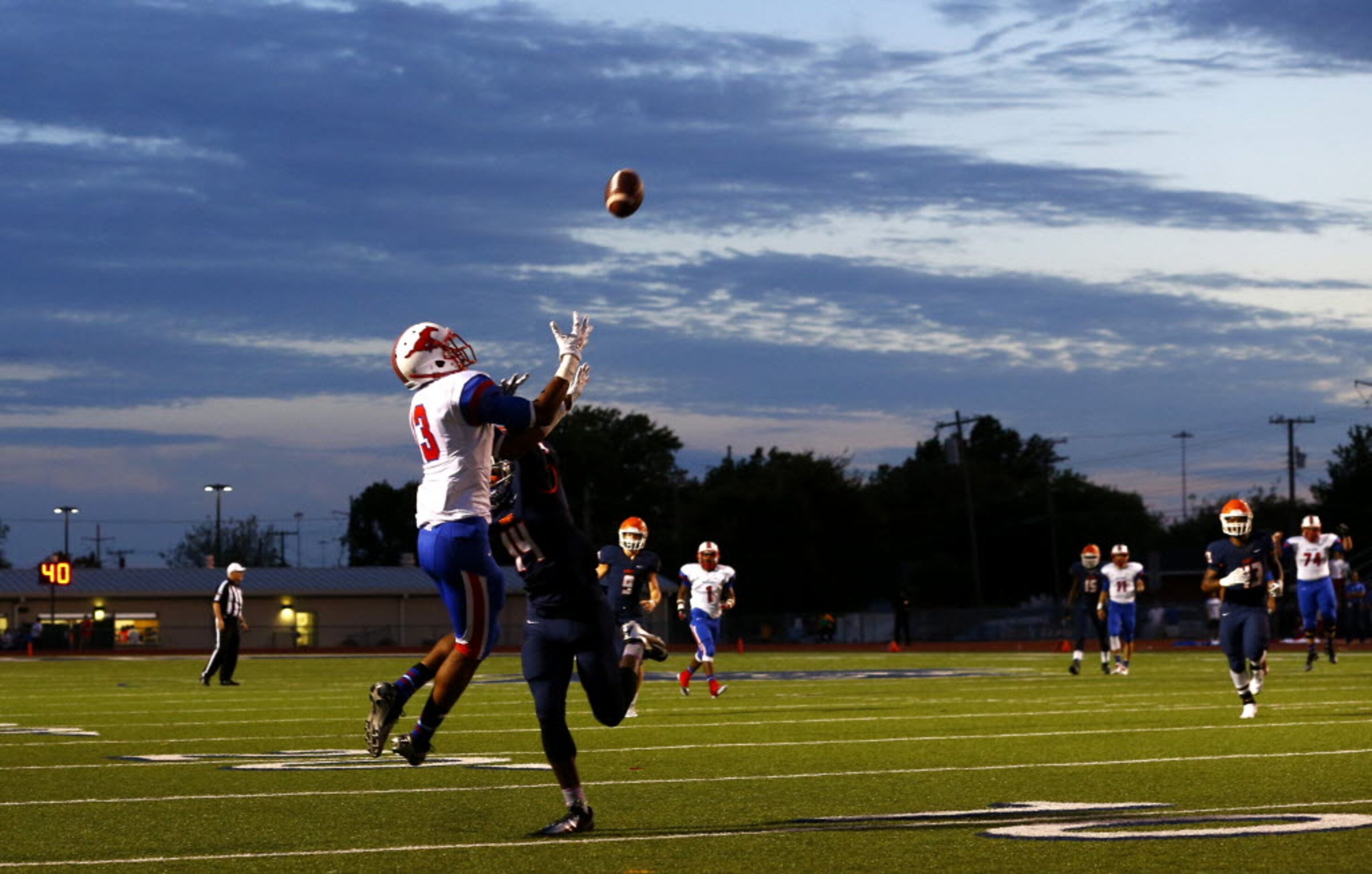 TXHSFB Richardson Pearce wide receiver De'Astone Barlow (13) goes up for the ball as...