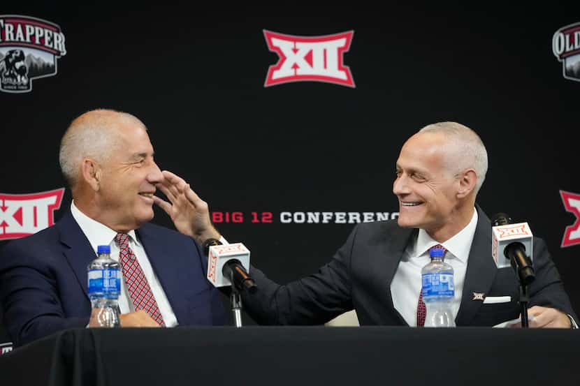 Incoming Big 12 commissioner Brett Yormark  (right) laughs with outgoing commissioner Bob...