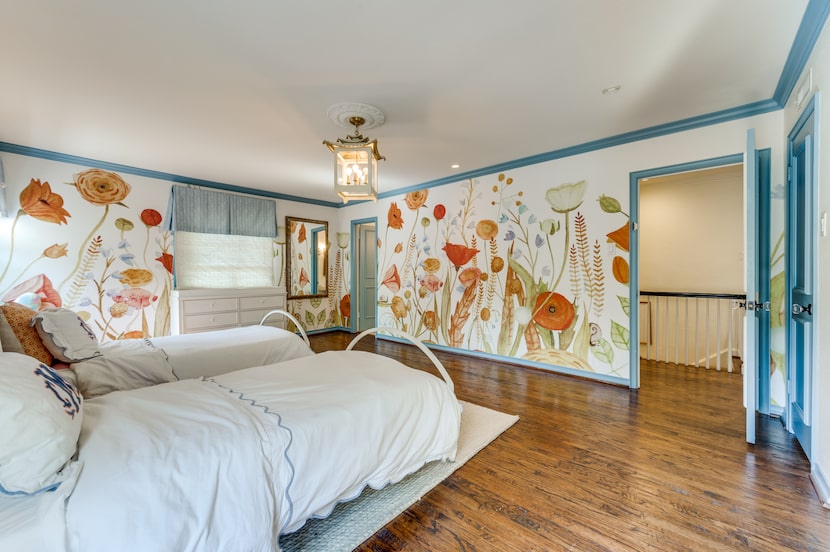 Bedroom with bright botanical wallpaper