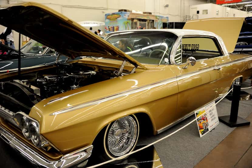 This 1962 Chevy Impala features custom paint is on display at Autorama car show at Market...