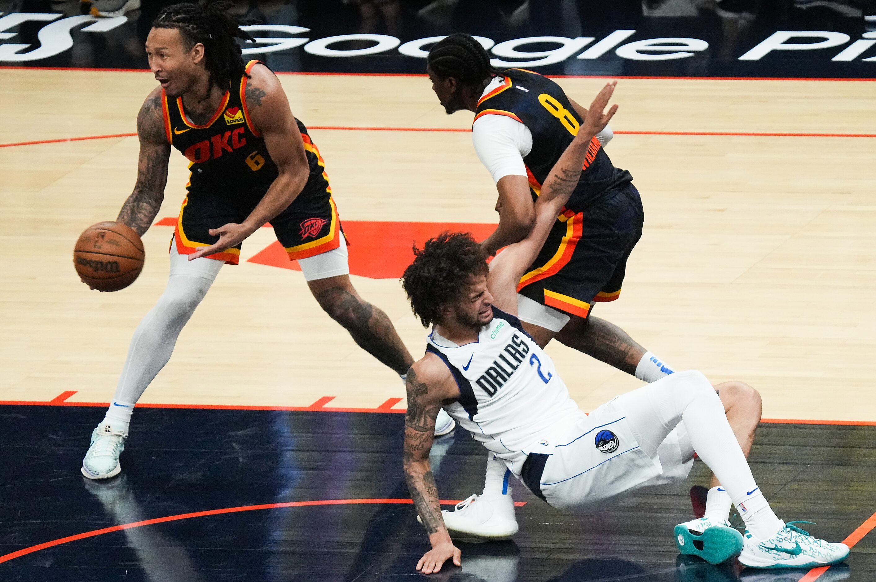 Dallas Mavericks center Dereck Lively II (2) falls the the floor after contact with Oklahoma...