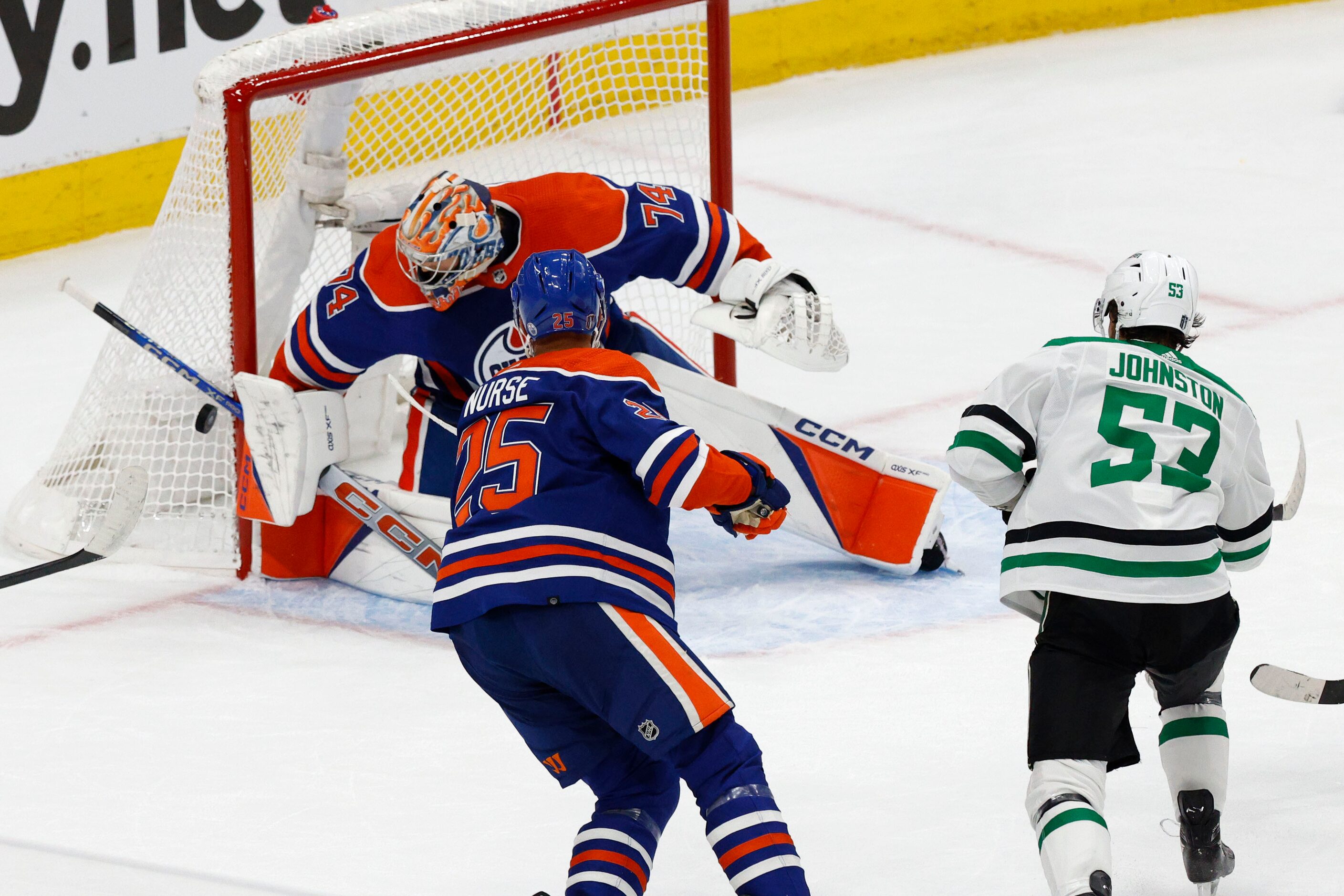 Edmonton Oilers goaltender Stuart Skinner (74) makes a save as Edmonton Oilers defenseman...