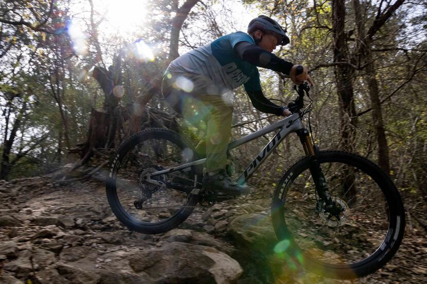 Jacob Nilz, president of Dallas Off-Road Bicycle Association (DORBA), goes down a double...