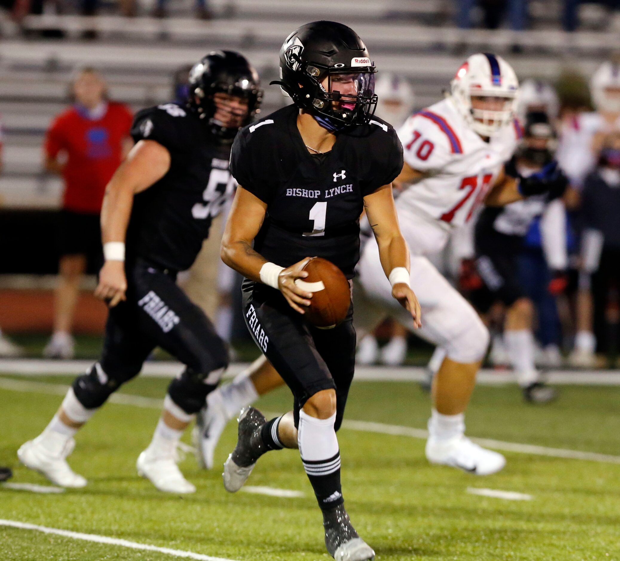 Bishop Lynch QB Michael Light (1) scrambles during the first half of high school football...