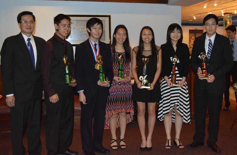 
Roger Hung (left) presented the Outstanding Service Award to (from left) Andrew Feng, Brian...