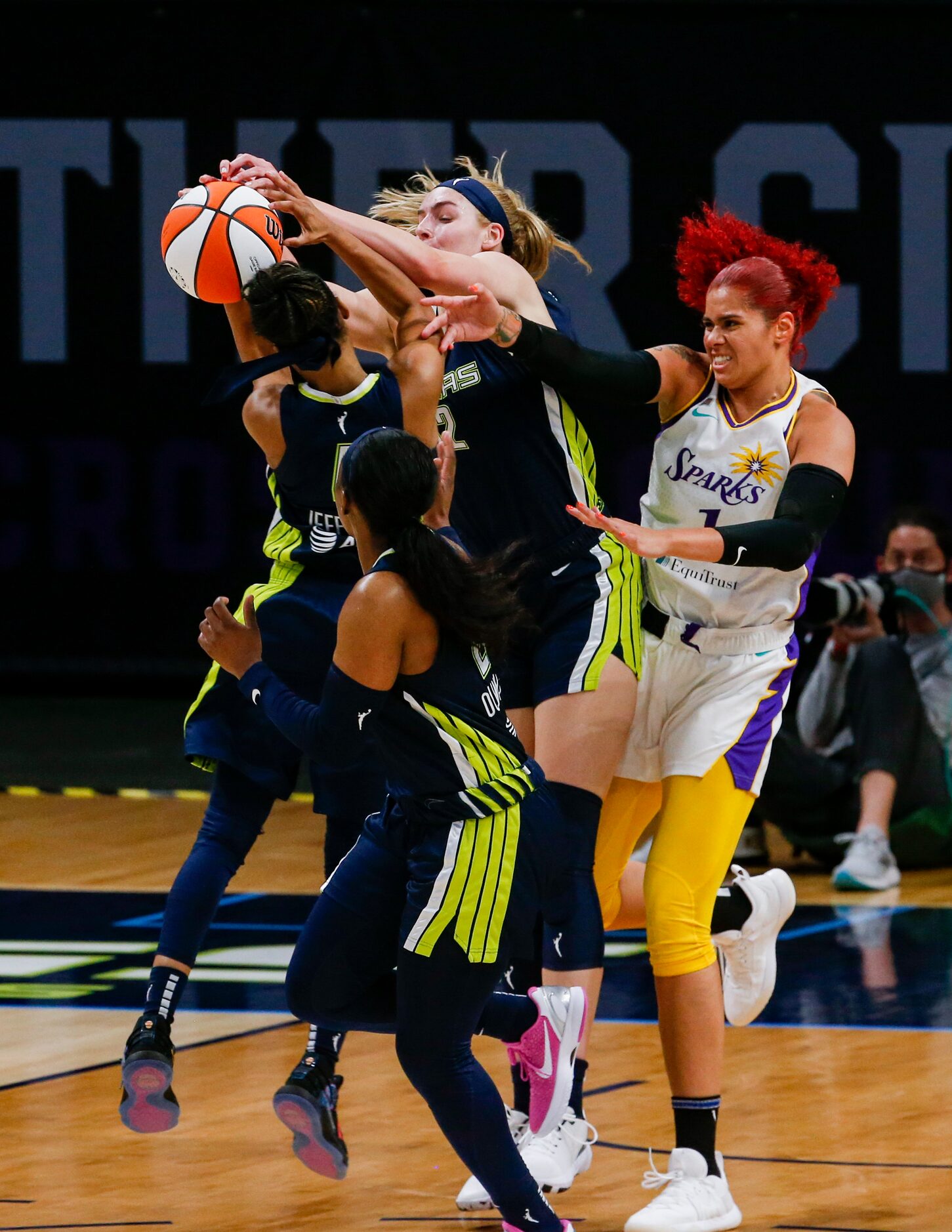 Los Angeles Sparks center Amanda Zahui B (1) fights the Dallas Wings for the ball during the...