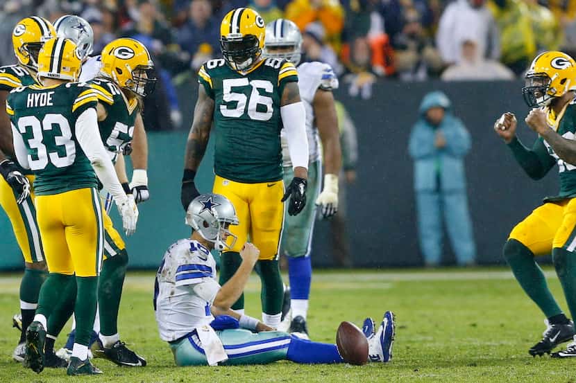 Dallas Cowboys quarterback Matt Cassel (16) reacts after being sacked by Green Bay Packers...