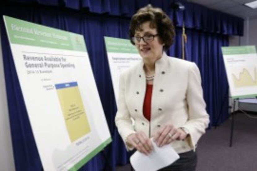 In 2013, then-Texas Comptroller Susan Combs is shown after a news conference at which she...