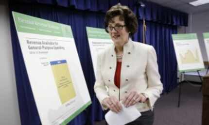  In 2013, then-Texas Comptroller Susan Combs is shown after a news conference at which she...