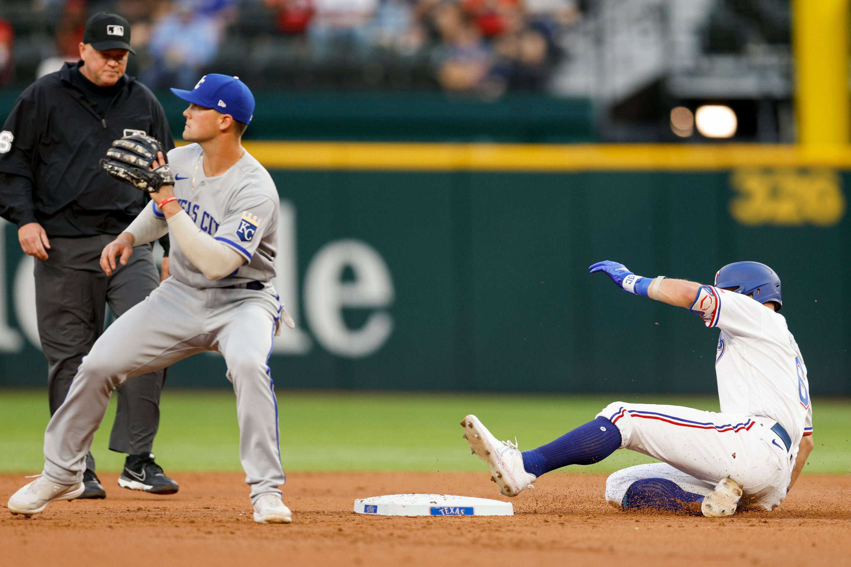 Texas Rangers third baseman Josh Jung (6) slides safely to second base ahead of Kansas City...