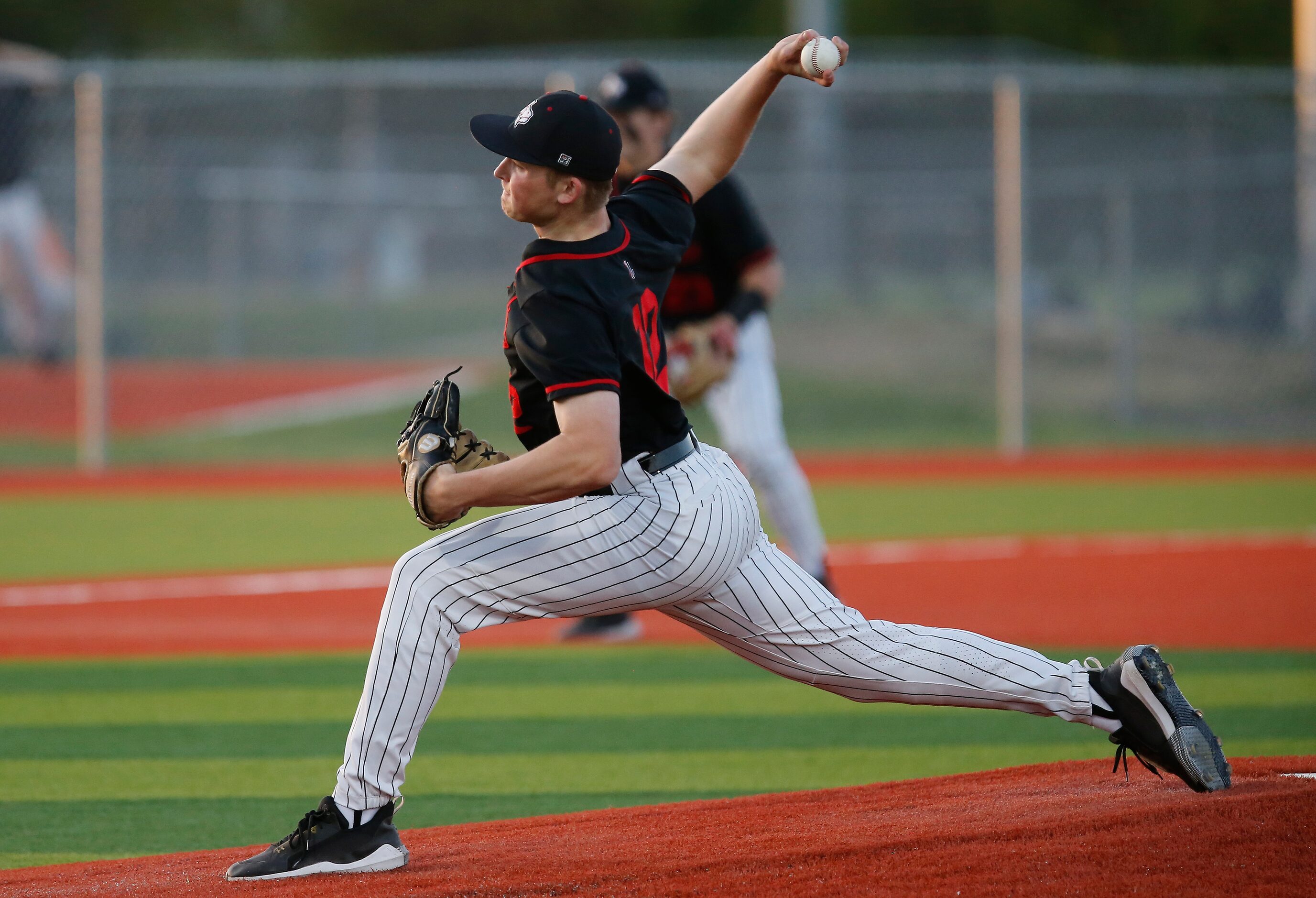 Lovejoy High School pitcher Parker Hutchins (12) delivers a pitch in the first inning as...