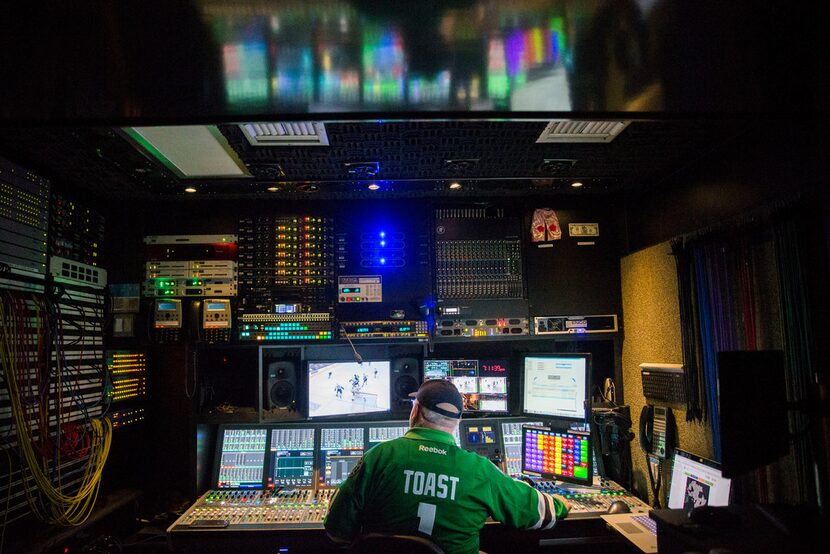 Senior audio specialist Tim "Toast" Record operates an audio mixer during Fox Sports...