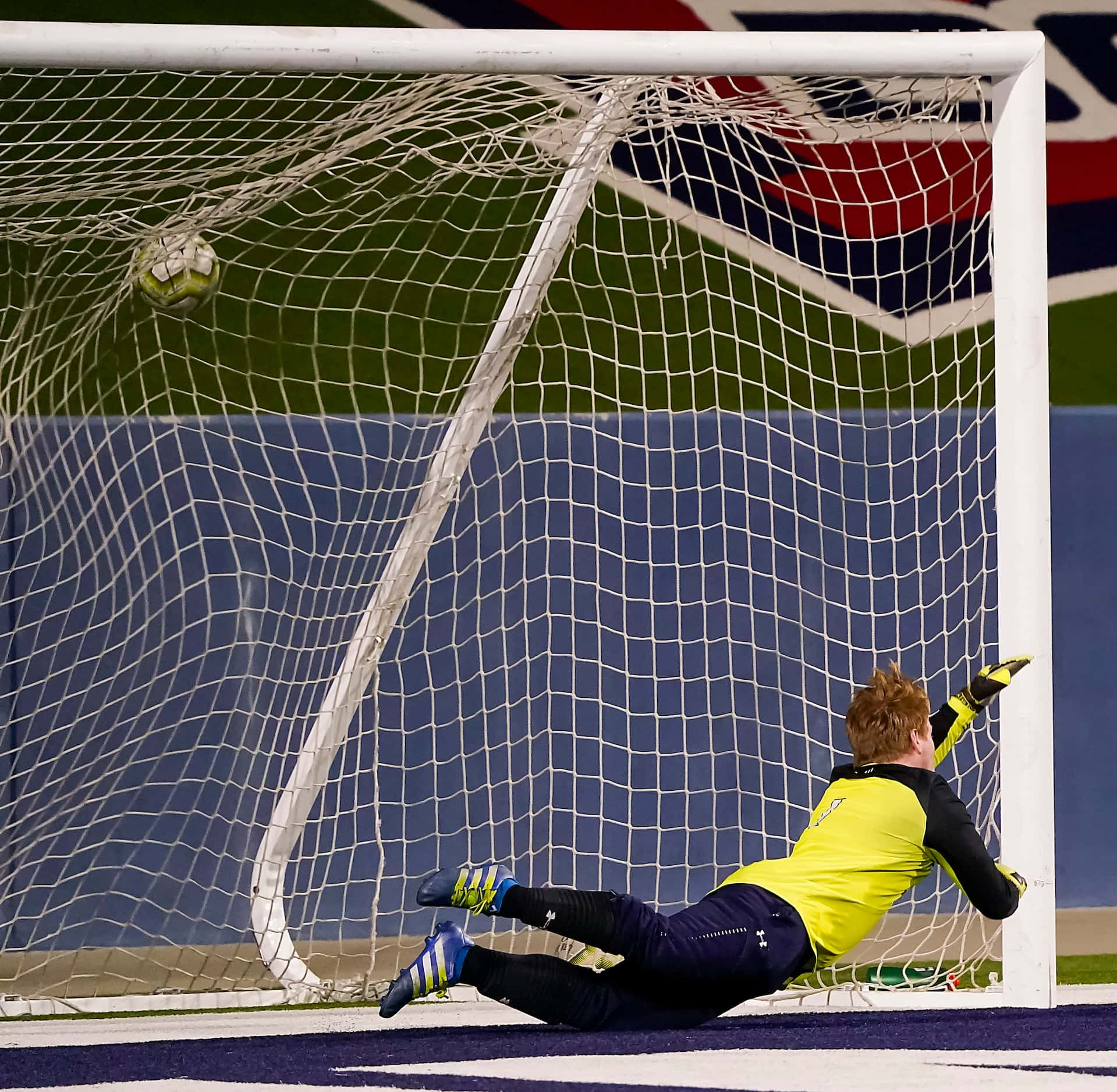 A shot by Jesuit midfielder Grant Koshakji gets past McKinney Boyd goalkeeper Ethan Uribe...