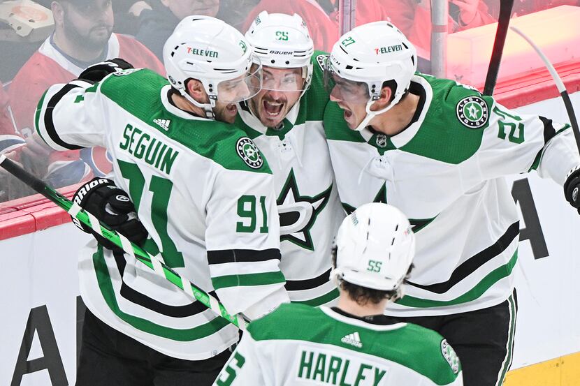 Dallas Stars' Tyler Seguin (91) celebrates with teammates after scoring against Montreal...