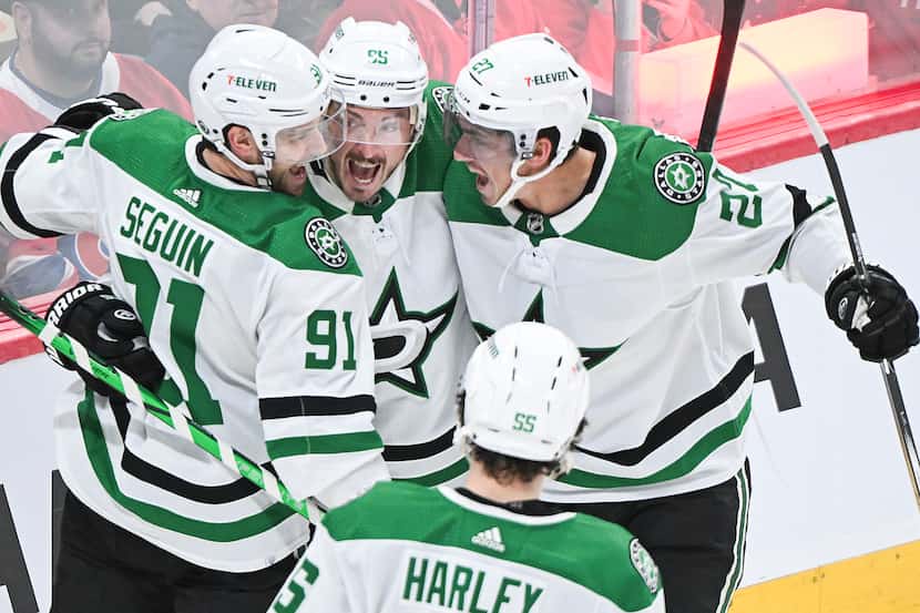 Dallas Stars' Tyler Seguin (91) celebrates with teammates after scoring against Montreal...