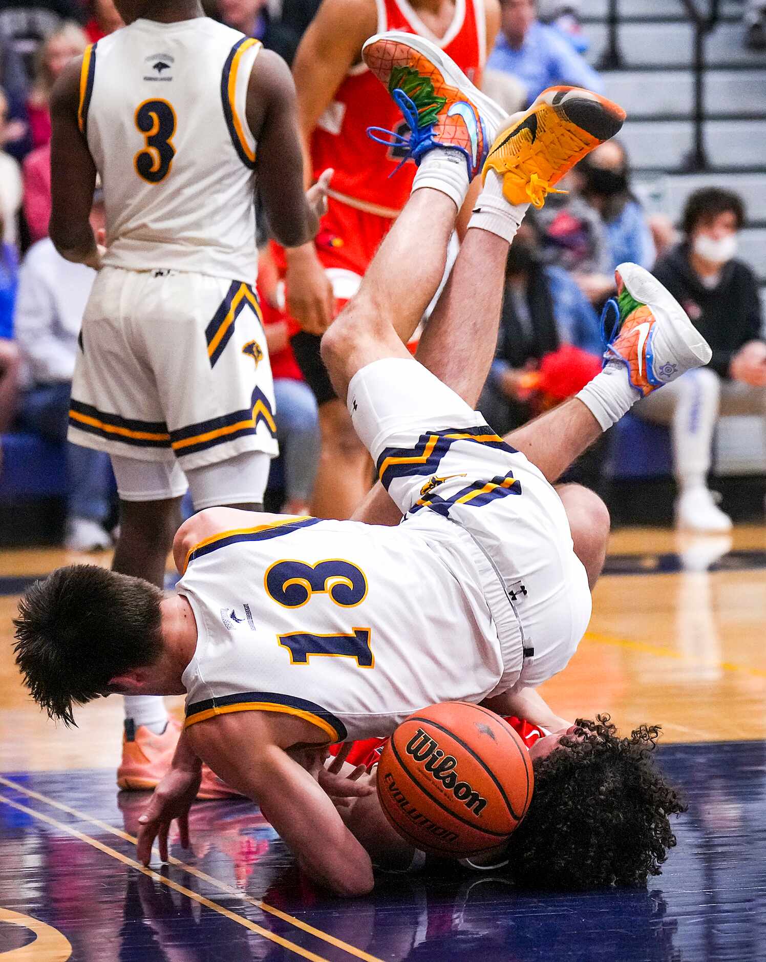 Prestonwood Christian's Jake Murphy (13) fights for a loose ball against John Paul II's Drew...