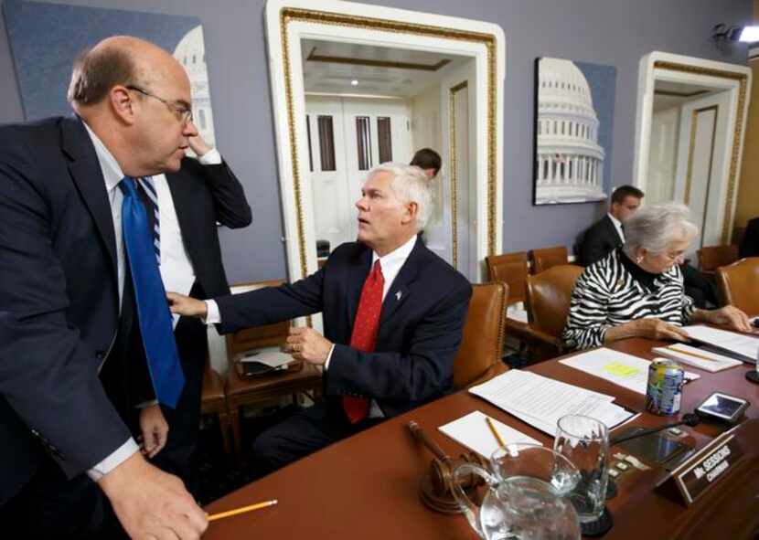 
Democratic Rep. James McGovern of Massachusetts (left) speaks with GOP House Rules...