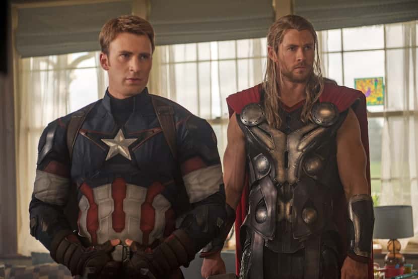 This photo provided by Disney/Marvel shows, Chris Evans, left, as Captain America/Steve...
