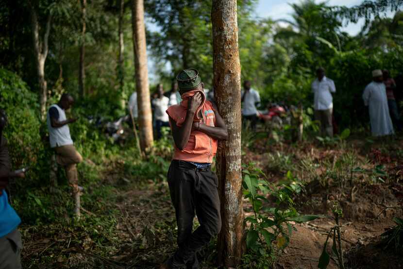 Ismael Kasereka, 14, wept at the funeral of his uncle and aunt in Beni, Congo, in July....