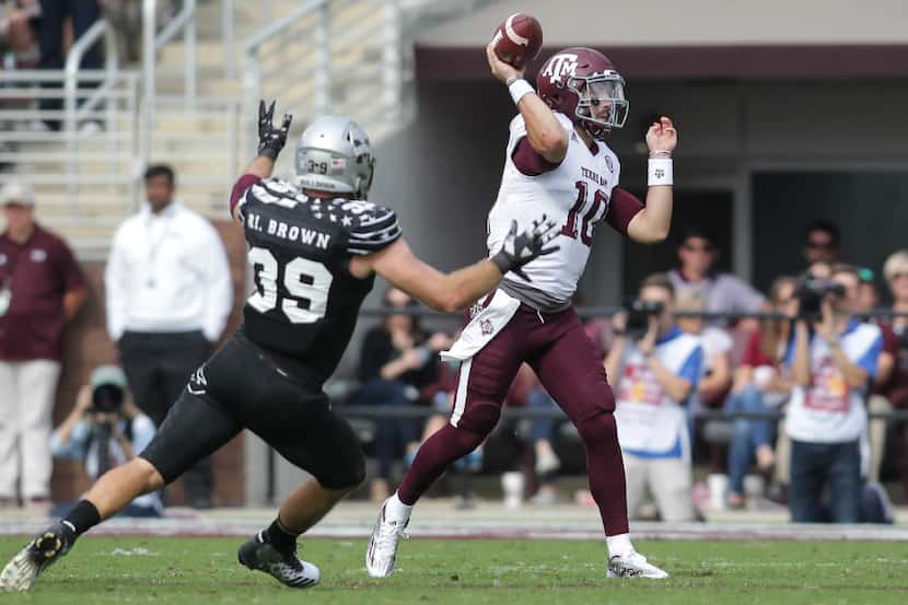 Texas A&M quarterback Jake Hubenak (10) fires a pass near the sideline as Mississippi State...