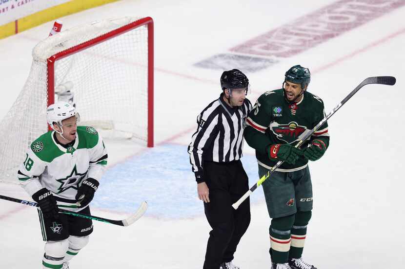 Minnesota Wild right wing Ryan Reaves (75) exchanges words with Dallas Stars center Max Domi...