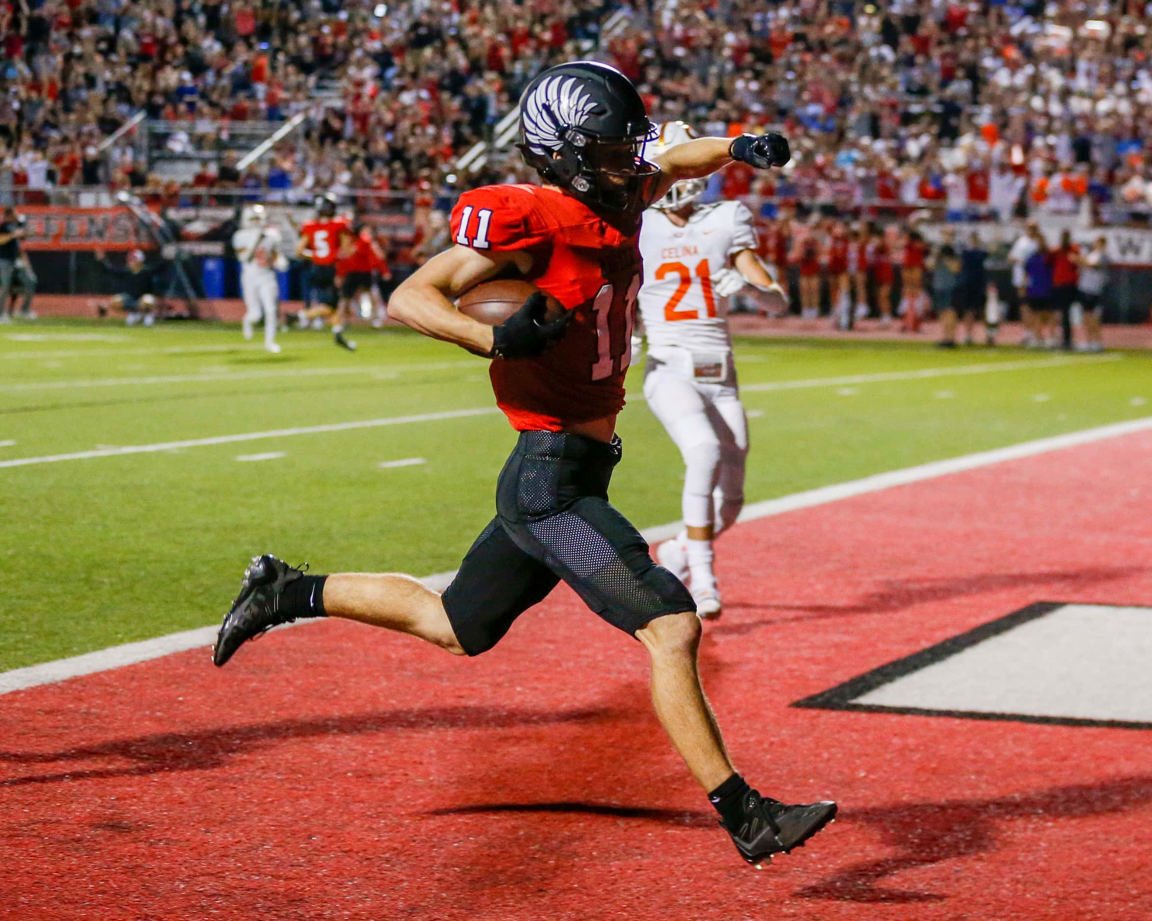 Argyle wide receiver Ward McCollum (11) pumps his fist after scoring a touchdown during the...