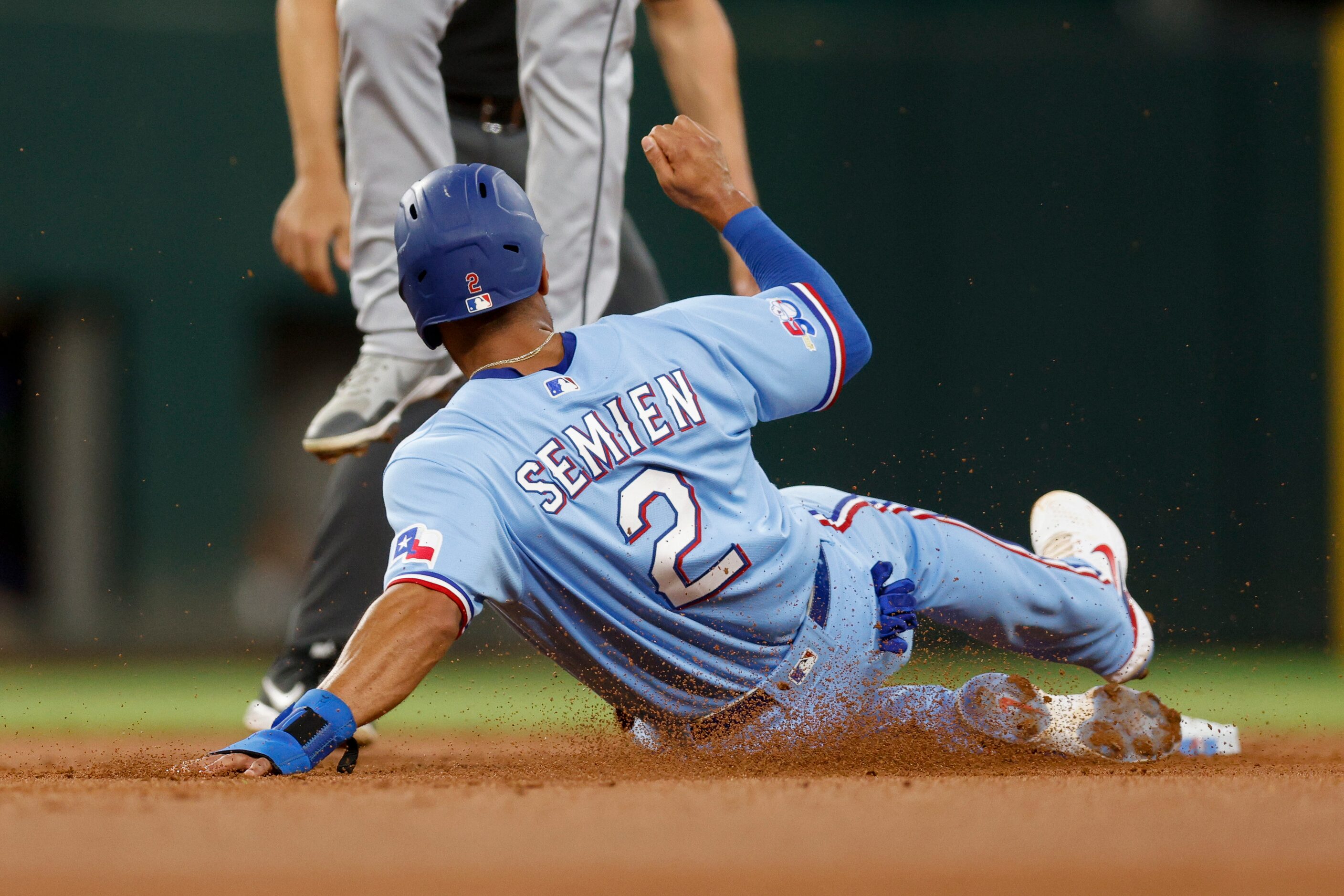 Texas Rangers second baseman Marcus Semien (2) steals second base during the first inning of...