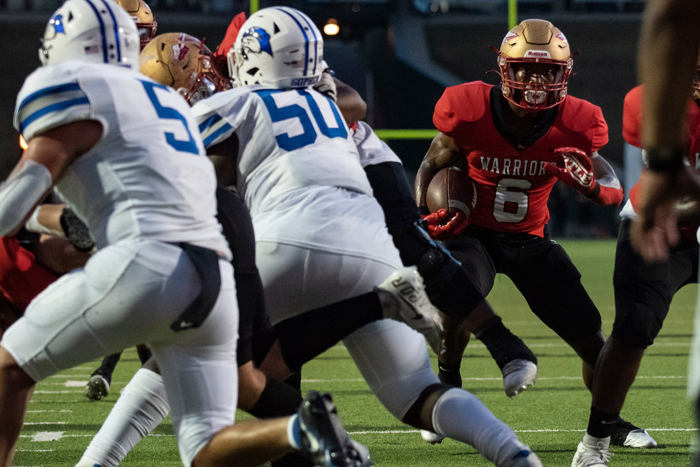 South Grand Prairie junior AJ Newberry (6) rushes up the middle to score a touchdown during...