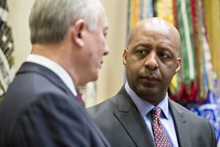 Marvin Ellison, right, talks with Greg Sandfort, CEO of Tractor Supply Co., before a...