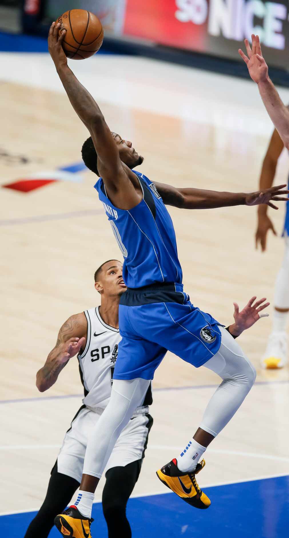Dallas Mavericks forward Dorian Finney-Smith (10) dunks during the second half of an NBA...