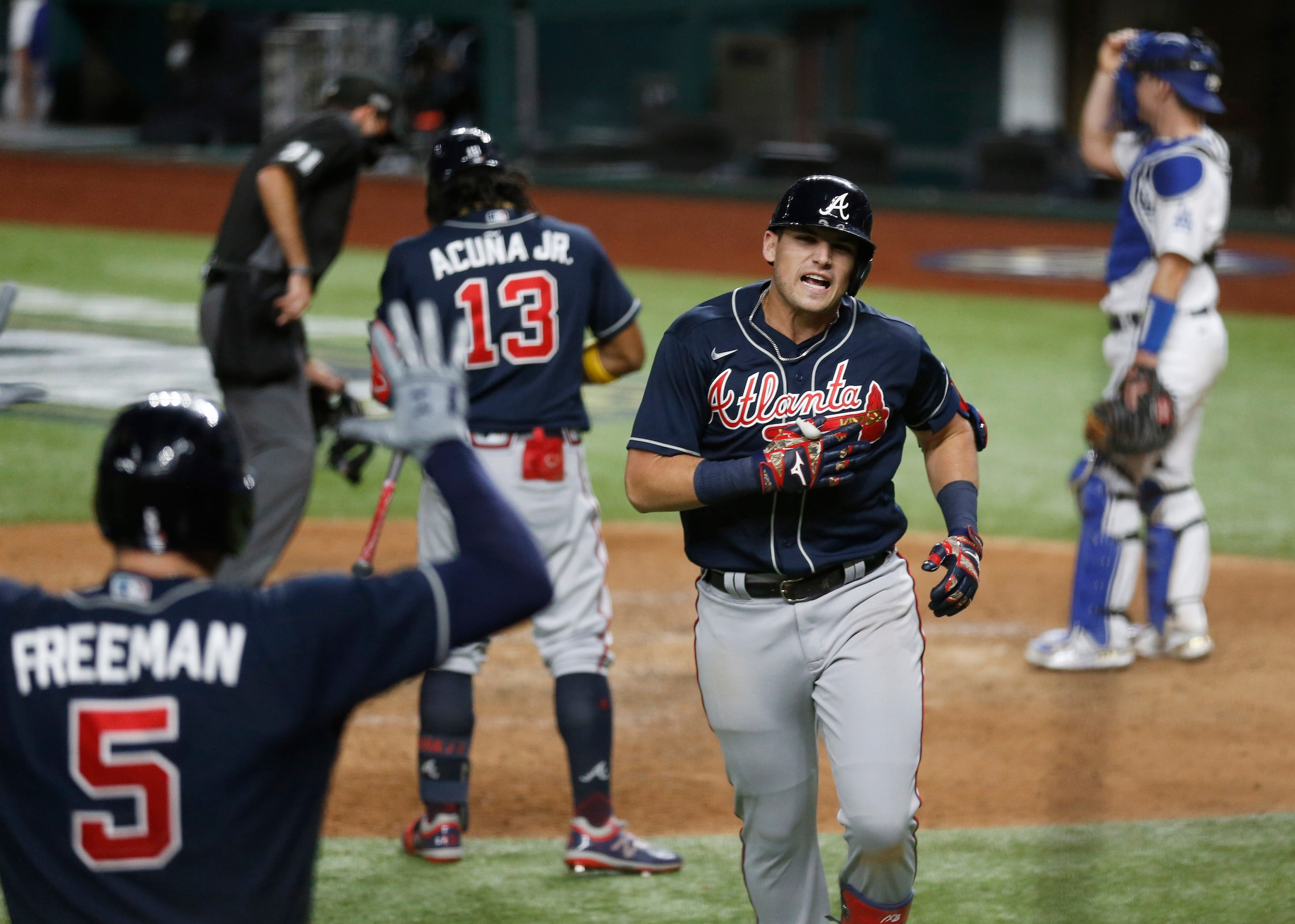 Atlanta Braves third baseman Austin Riley (27) celebrates with Atlanta Braves first baseman...