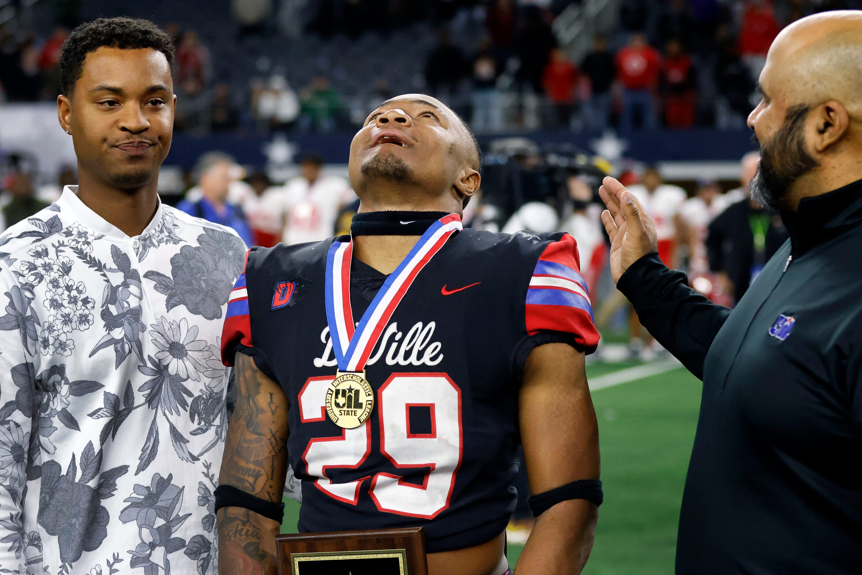 Duncanville’s Caden Durham (29) is overcome with emotion after being named the most valuable...