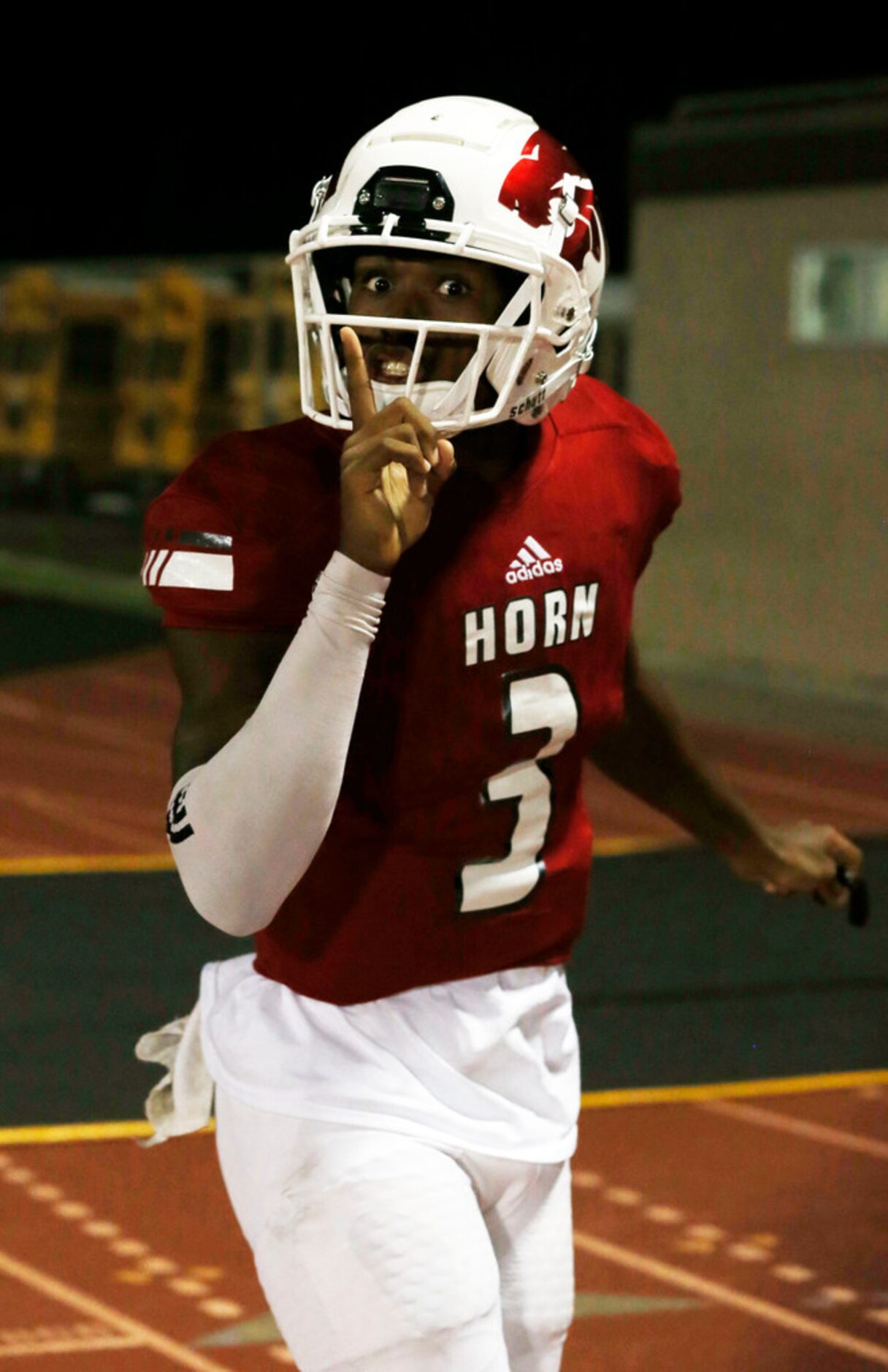 Mesquite Horn QB Jermaine Givens (3) wags his finger, after scoring a touchdown during the...